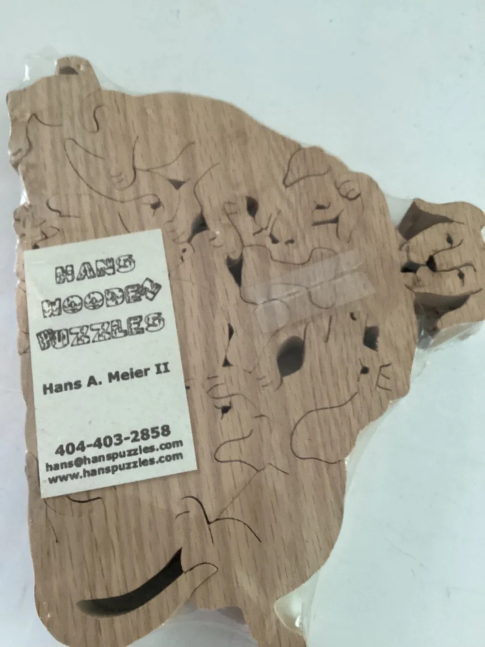 Hans Wooden Dog Shapes puzzle  9 pieces of dogs, bones and a ball